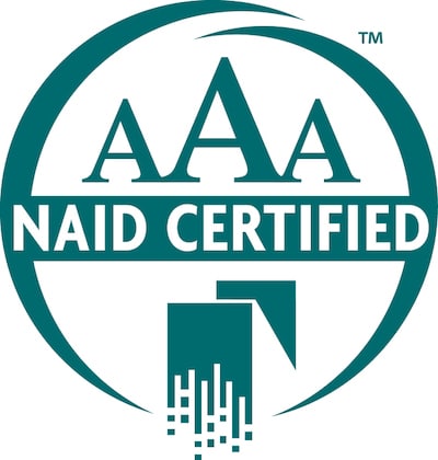 llustration of a teal-colored NAID AAA Certified logo, with the text "AAA NAID CERTIFIED"
